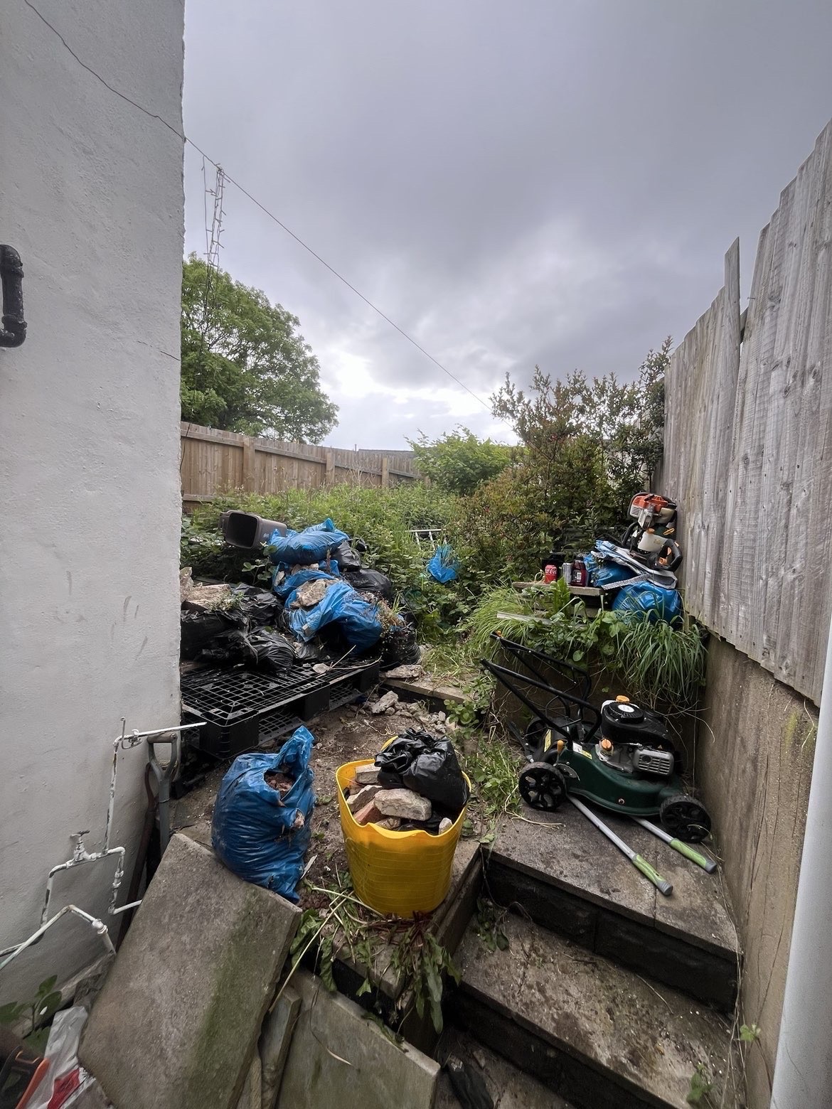 Rear garden waste removal before
